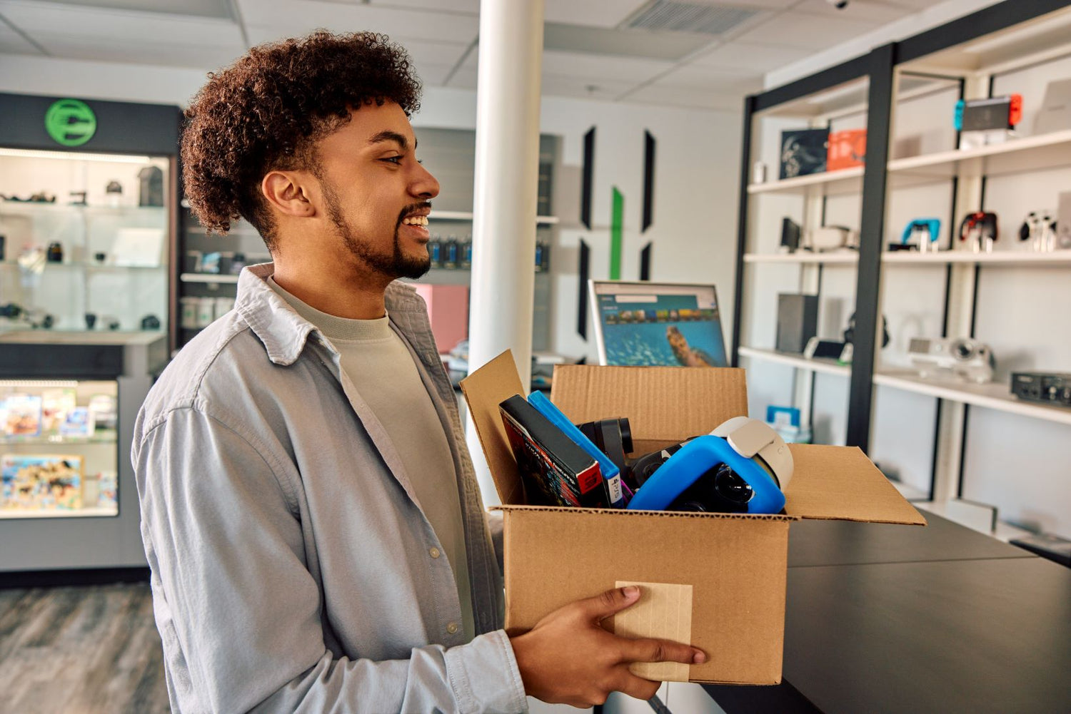 man with a box of electronics