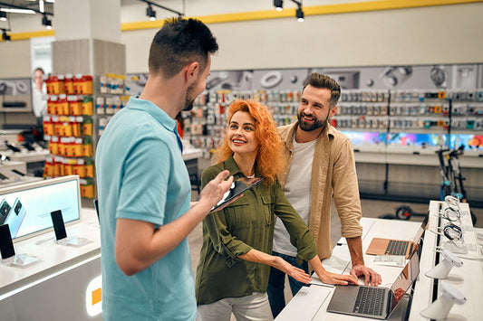 Customer selling personal electronics during walk-in evaluation at PayMore Santa Clarita