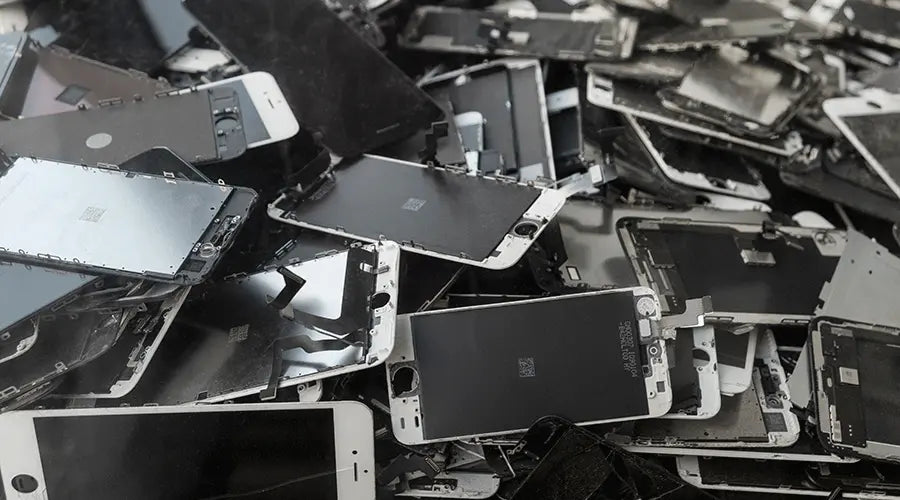Used smartphones and laptops ready for resale instead of disposal