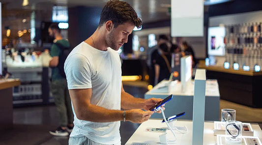 Electronics specialist evaluating a smartphone in Santa Clarita